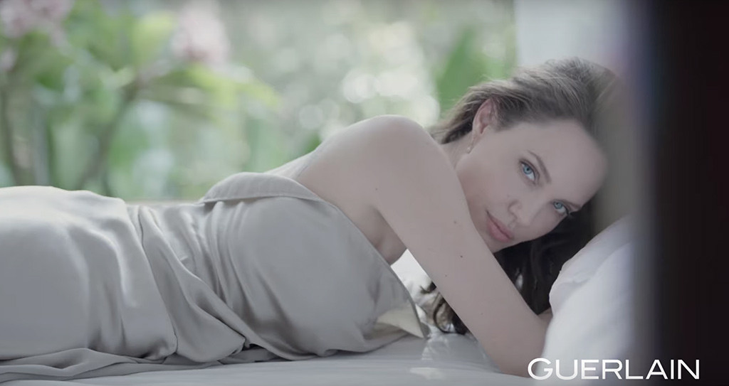Angelina Jolie Is a Wild Thing Rolling in the Sheets in Sexy Perfume Ad.